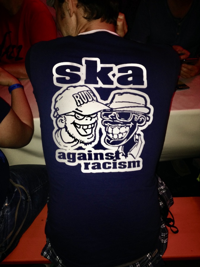 Photo of a T-shirt that says "Ska against racism" and shows a black male face and a white male face smiling. Photography by Rhonda Jesckey.
