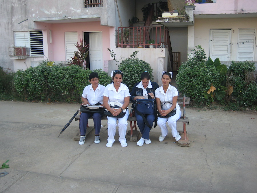 Nurses sitting on a bench in Vinales, Cuba in 2012. Photography by Rhonda Jesckey.